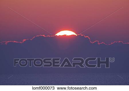 Sea at sunrise View Large Photo Image Stock Image - Sea at sunrise. Fotosearch