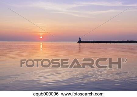 Stock Photograph - Sea at sunset. Fotosearch