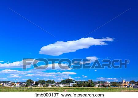 Stock Photo - Sky and clouds in the Japanese countryside. Fotosearch