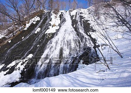 Stock Photo - Snow at Oshinkoshin waterfall, Hokkaido. Fotosearch