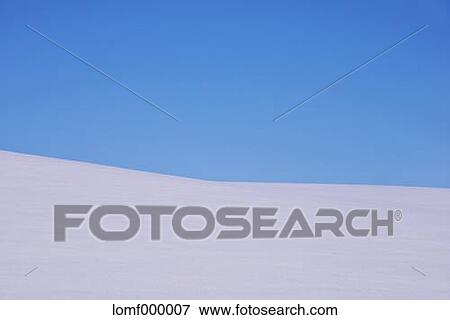 Snow field and blue sky View Large Photo Image Stock Photo - Snow field and blue sky. Fotosearch