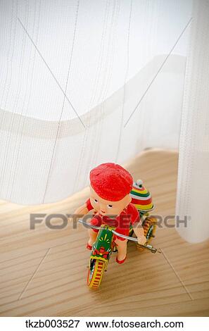 Tin toy by the window View Large Photo Image Stock Photo - Tin toy by the window. Fotosearch