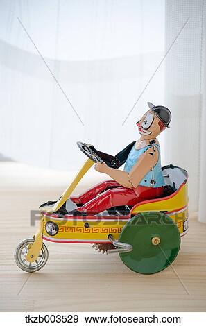 Stock Photo - Tin toy by the window. Fotosearch