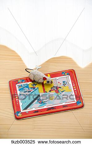 Tin toys by the window View Large Photo Image Stock Photography - Tin toys by the window. Fotosearch