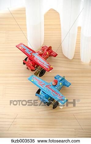 Tin toys by the window View Large Photo Image Stock Photography - Tin toys by the window. Fotosearch