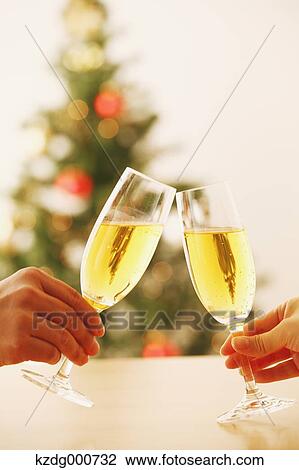 Couple toasting with Champagne View Large Photo Image Stock Image - Couple toasting with Champagne. Fotosearch