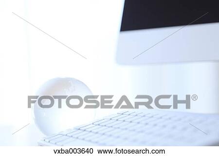 Glass globe and computer View Large Photo Image Stock Image - Glass globe and computer. Fotosearch
