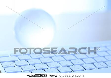 Glass globe and computer View Large Photo Image Stock Photo - Glass globe and computer. Fotosearch