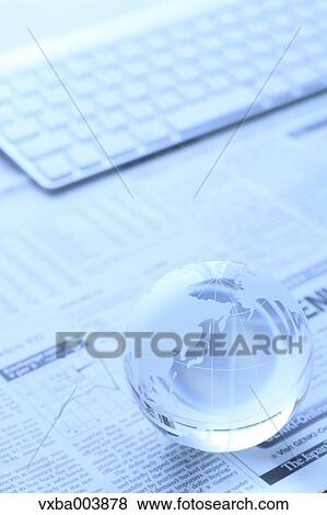 Stock Photo - Glass globe and computer. Fotosearch
