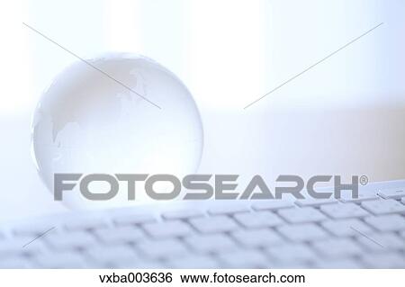 Glass globe and computer View Large Photo Image Stock Photograph - Glass globe and computer. Fotosearch