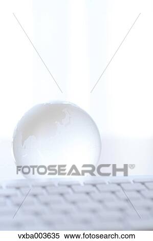 Glass globe and computer View Large Photo Image Stock Photography - Glass globe and computer. Fotosearch