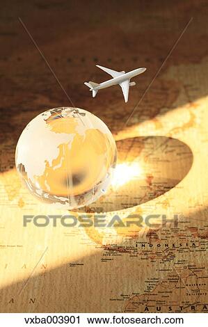 Stock Image - Glass globe and map. Fotosearch