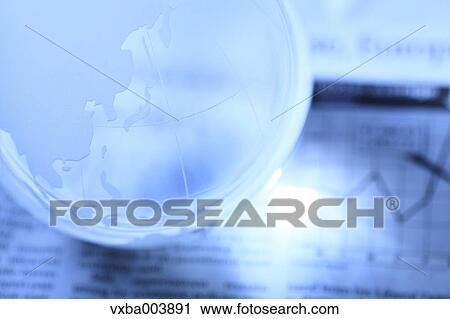 Glass globe and newspaper View Large Photo Image Stock Image - Glass globe and newspaper. Fotosearch