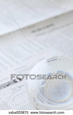 Glass globe and newspaper View Large Photo Image Stock Photography - Glass globe and newspaper. Fotosearch