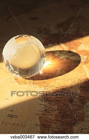 Glass globe on map View Large Photo Image Stock Photo - Glass globe on map. Fotosearch