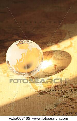 Glass globe on map View Large Photo Image Stock Photography - Glass globe on map. Fotosearch