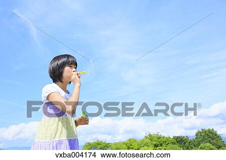 Japanese girl playing in nature View Large Photo Image Picture - Japanese girl playing in nature. Fotosearch