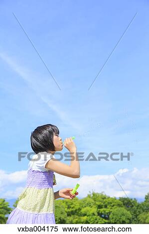 Japanese girl playing in nature View Large Photo Image Stock Photography - Japanese girl playing in nature. Fotosearch