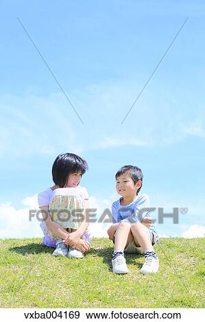 Stock Photo - Japanese kids on a hill. Fotosearch