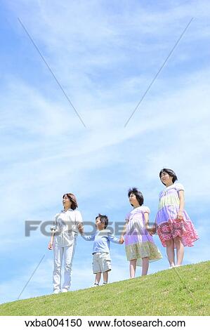 Japanese mum and kids on a hill View Large Photo Image Stock Image - Japanese mum and kids on a hill. Fotosearch