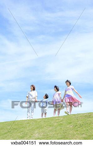 Japanese mum and kids on a hill View Large Photo Image Stock Image - Japanese mum and kids on a hill. Fotosearch