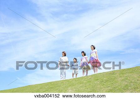 Japanese mum and kids on a hill View Large Photo Image Stock Image - Japanese mum and kids on a hill. Fotosearch