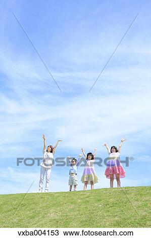 Japanese mum and kids on a hill View Large Photo Image Stock Image - Japanese mum and kids on a hill. Fotosearch