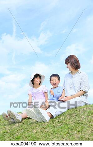 Japanese mum and kids on a hill View Large Photo Image Stock Image - Japanese mum and kids on a hill. Fotosearch