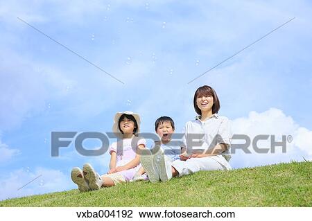 Japanese mum and kids on a hill View Large Photo Image Stock Image - Japanese mum and kids on a hill. Fotosearch