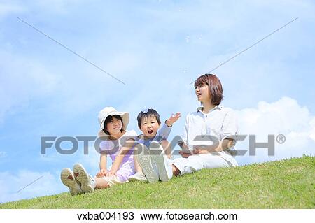 Japanese mum and kids on a hill View Large Photo Image Stock Image - Japanese mum and kids on a hill. Fotosearch