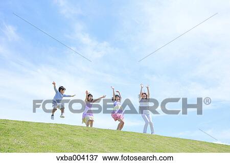 Japanese mum and kids on a hill View Large Photo Image Stock Photo - Japanese mum and kids on a hill. Fotosearch
