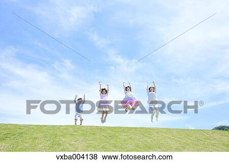 Japanese mum and kids on a hill View Large Photo Image Stock Photo - Japanese mum and kids on a hill. Fotosearch