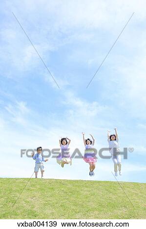 Japanese mum and kids on a hill View Large Photo Image Stock Photo - Japanese mum and kids on a hill. Fotosearch