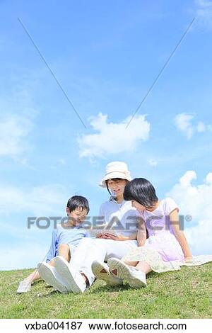 Japanese mum and kids on a hill View Large Photo Image Stock Photo - Japanese mum and kids on a hill. Fotosearch