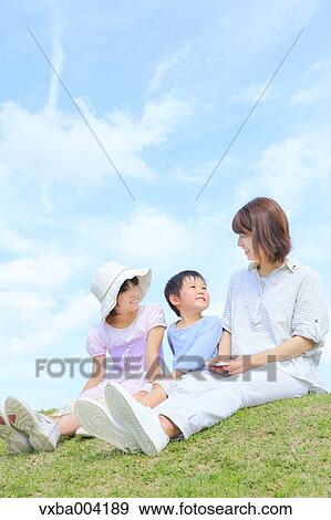 Japanese mum and kids on a hill View Large Photo Image Stock Photo - Japanese mum and kids on a hill. Fotosearch