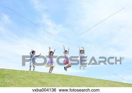 Japanese mum and kids on a hill View Large Photo Image Stock Photograph - Japanese mum and kids on a hill. Fotosearch
