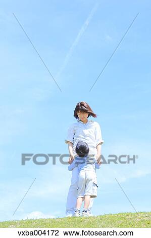 Japanese mum and son on a hill View Large Photo Image Stock Image - Japanese mum and son on a hill. Fotosearch