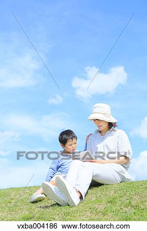 Japanese mum and son on a hill View Large Photo Image Stock Photograph - Japanese mum and son on a hill. Fotosearch