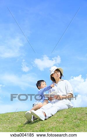 Japanese mum and son on a hill View Large Photo Image Stock Photography - Japanese mum and son on a hill. Fotosearch