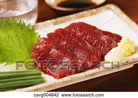 Stock Image - Japanese style raw horse meat. Fotosearch