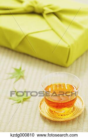 Japanese style wrapping cloth and green tea on Tatami mat View Large Photo Image Stock Image - Japanese style wrapping cloth and green tea on Tatami mat. Fotosearch