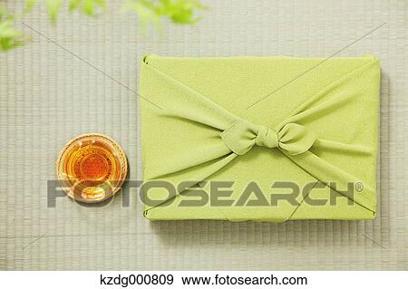Japanese style wrapping cloth and green tea on Tatami mat View Large Photo Image Stock Photo - Japanese style wrapping cloth and green tea on Tatami mat. Fotosearch