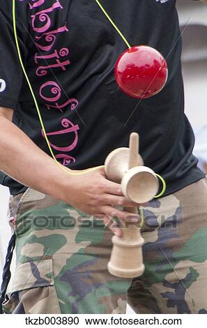 Stock Image - Japanese traditional Kendama Cup-And-Ball Game. Fotosearch