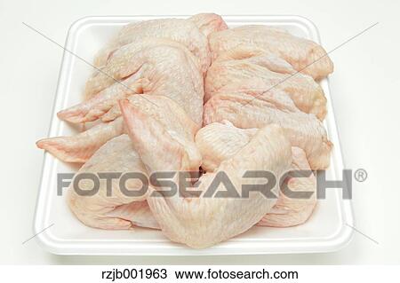Stock Image - Raw chicken wings. Fotosearch