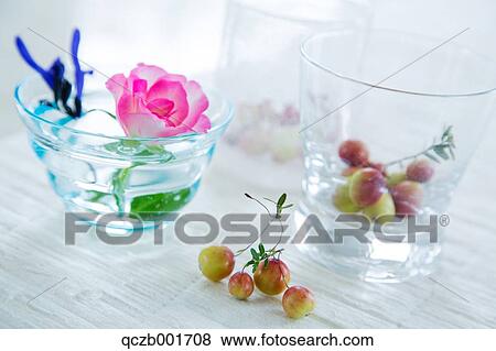 Rose and fruits in water glasses View Large Photo Image Stock Photo - Rose and fruits in water glasses. Fotosearch