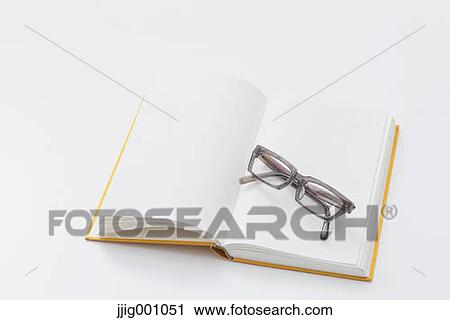Stock Image - Book and glasses. Fotosearch