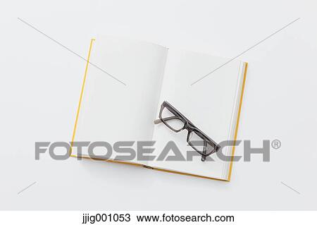 Stock Image - Book and glasses. Fotosearch