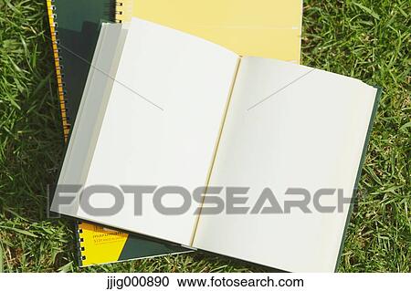 Book and notebooks on grass View Large Photo Image Stock Image - Book and notebooks on grass. Fotosearch