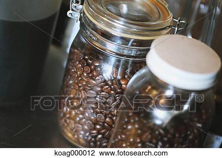 Stock Image - Bottled coffee beans . Fotosearch