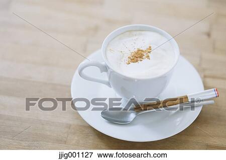 Cappuccino on a table View Large Photo Image Stock Photo - Cappuccino on a table. Fotosearch